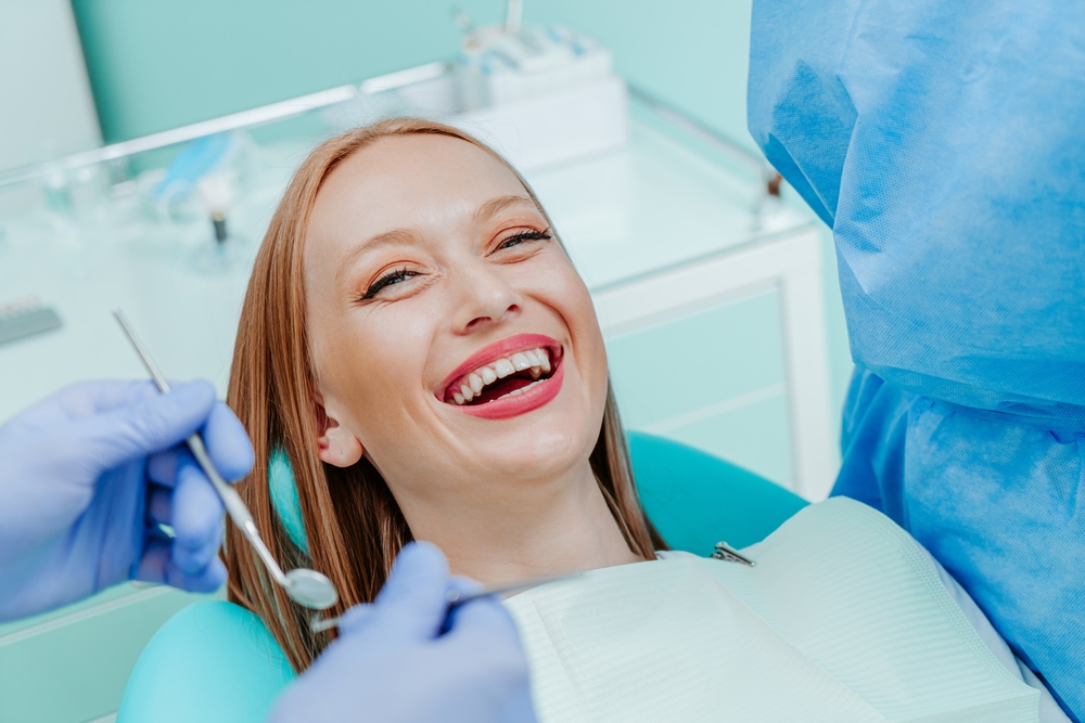 Relaxed Patient During Cosmetic Dentistry Visit - Porcelain Veneers Orange County A cheerful patient enjoys a comfortable dental appointment while preparing for porcelain veneers and smile enhancement - Porcelain Veneers Orange County