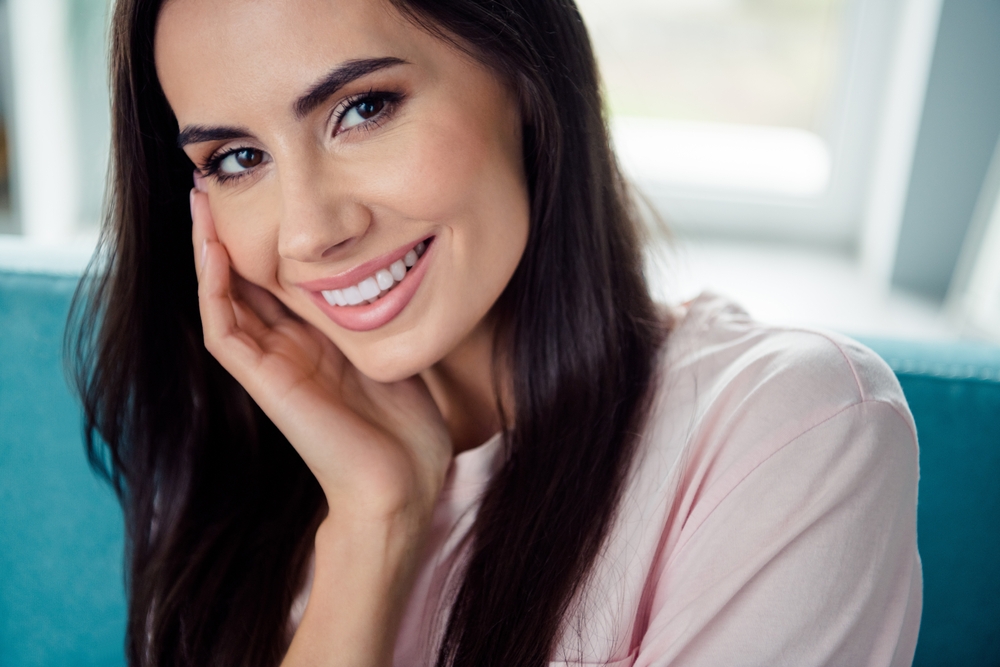 Bright Smile and Cosmetic Veneer Results - Porcelain Veneers Orange County A close-up of a radiant smile showing smooth, white teeth achieved through porcelain veneer treatment - Porcelain Veneers Orange County