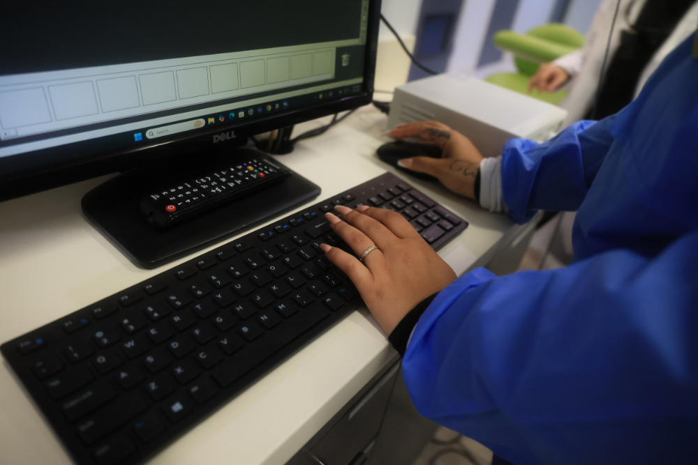 Close-up of dental staff using modern computer systems and digital tools to support efficient, high-quality patient care and treatment planning - Laguna Hills Dentist