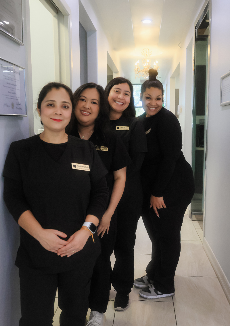 Professional and welcoming Smile Craft Dental Group staff posing in the clinic hallway, showcasing compassionate care and a supportive team environment - Laguna Hills Dentist