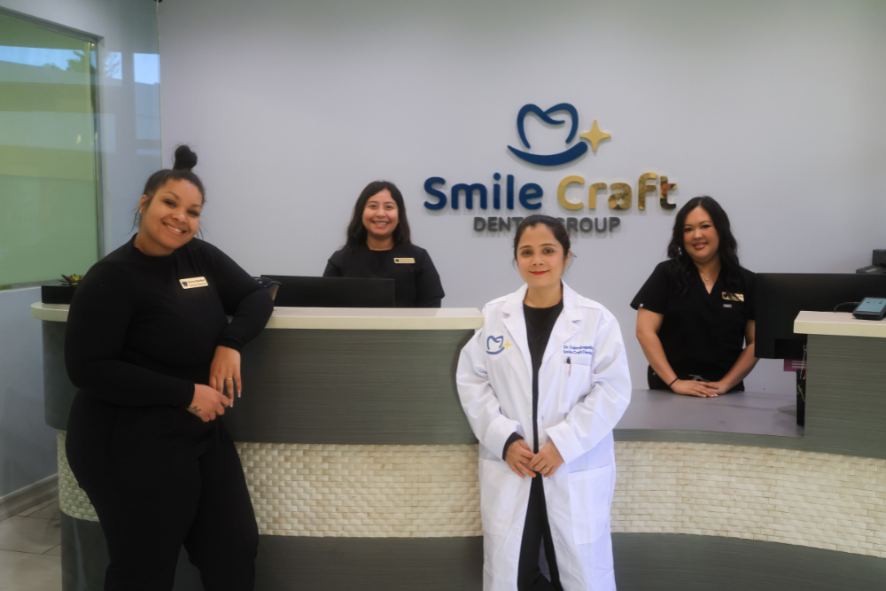 The friendly front desk and dental staff at Smile Craft Dental Group greeting patients in a modern, clean, and professional reception area - Laguna Hills Dentist