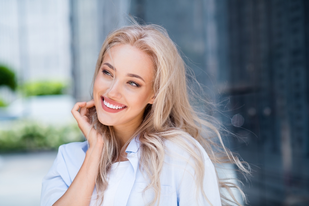 Veneer Shade Matching Consultation - Porcelain Veneers Orange County A dentist helps a patient choose the perfect veneer shade for a bright, natural-looking smile transformation - Porcelain Veneers Orange County