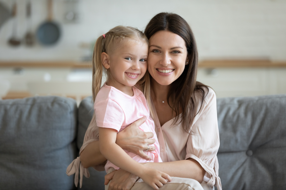 A mother and her daughter sharing a warm smile, reflecting family-oriented dental care that supports lifelong oral health – Laguna Hills dentist.