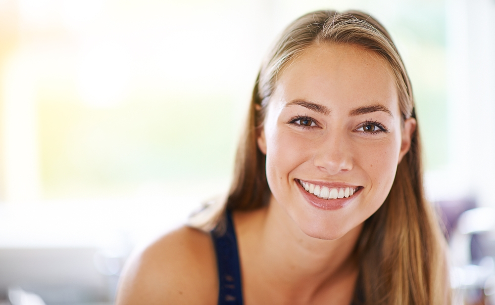 A woman with a radiant, healthy smile that highlights the results of expert dental care and modern cosmetic treatments – Laguna Hills dentist.